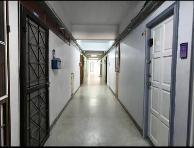 an empty hallway with two doors and a hallway sidx sidx at Cozy Patong studio apartment in Patong Beach