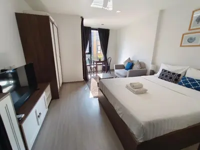 a hotel room with a bed and a television at The base central phuket in Phuket Town