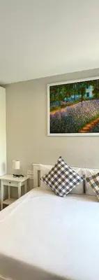 a bedroom with a white bed with a painting on the wall at G15 ВАТСАП669З5В2I976 оплата РУБЛИ in Nai Yang Beach