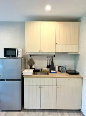 a kitchen with white cabinets and a sink and a refrigerator at G15 ВАТСАП669З5В2I976 оплата РУБЛИ in Nai Yang Beach