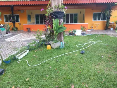 a tree with a hose hooked up to a tree at Kathu Waterfall Bungalow Holyday home in Ban Huai Luk (1)