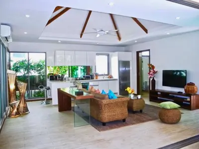a living room with a couch and a table at Rawai Beach Private Pool Villa -3 Bedrooms in Rawai Beach