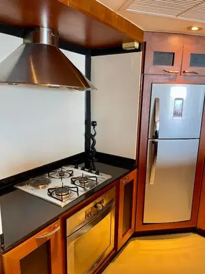 a kitchen with a stove and a refrigerator at Kata Sea View Sanctuary in Kata Beach