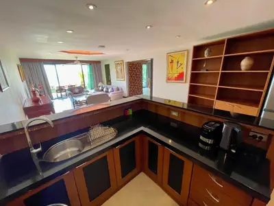 a kitchen with a sink and a counter top at Kata Sea View Sanctuary in Kata Beach