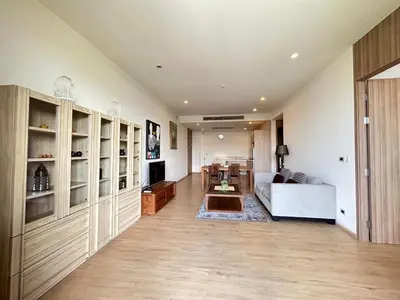 a living room with a couch and a table at 2 Bedroom Beachfront Apartment With Sea Views in Mai Khao Beach