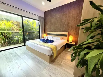 a bedroom with a bed and a large window at Villa Christal - Modern 3 bedrooms with pool in Ban Saiyuan (1)