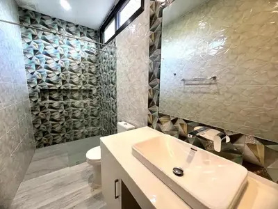a bathroom with a sink and a shower and a toilet at Villa Christal - Modern 3 bedrooms with pool in Ban Saiyuan (1)