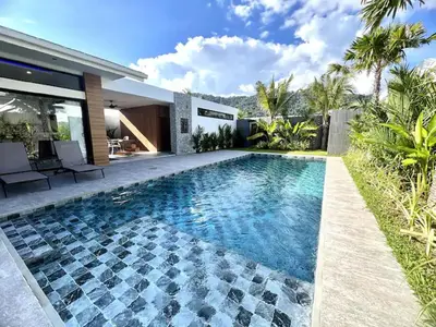 a swimming pool in the backyard of a house at Villa Christal - Modern 3 bedrooms with pool in Ban Saiyuan (1)