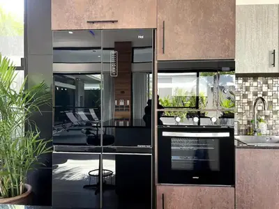 a kitchen with glass doors and a counter top at Villa Christal - Modern 3 bedrooms with pool in Ban Saiyuan (1)