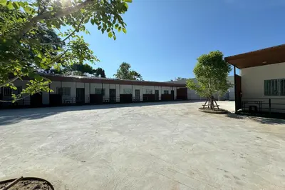 an empty parking lot in front of a building at MYP Cherngtalay in Phuket Town