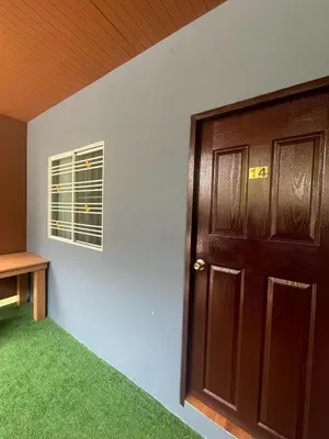 an empty room with a door and a window at MYP Cherngtalay in Phuket Town