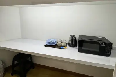 a microwave sitting on a counter in a room at MYP Cherngtalay in Phuket Town