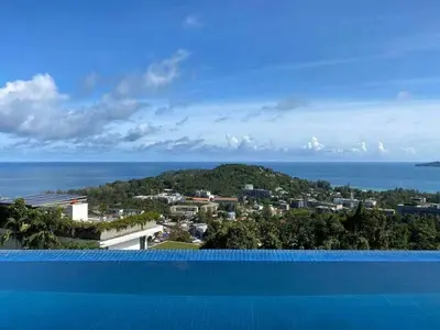 a view of the ocean from a swimming pool at Villa Amonteera in Surin Beach