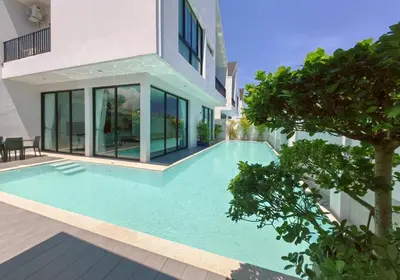 a swimming pool in the backyard of a house at Bangtao Luxury Pool Villa - Prymana in Phuket Town