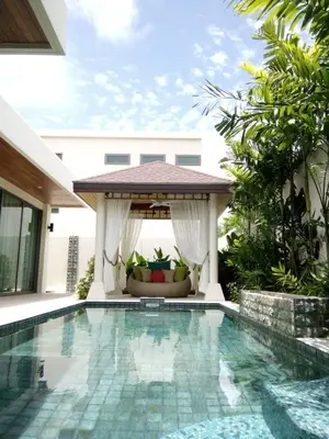 a swimming pool in a villa with a gazebo at 4 Bedrooms Private Pool Villa near Rawai Beach in Rawai Beach