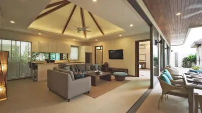a living room with a couch and a table at 4 Bedrooms Private Pool Villa near Rawai Beach in Rawai Beach