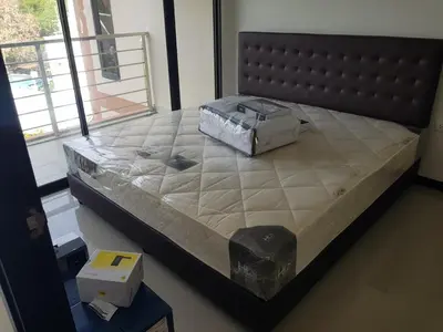 a large bed in a room with a large bedvisor at Rawai beach condominium Phuket in Nai Harn Beach