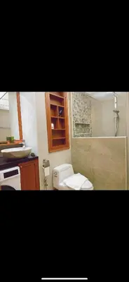 a small bathroom with a toilet and a sink at PATONG TOWER SEA FACING HIGH FLOOR New Bathroom in Patong Beach