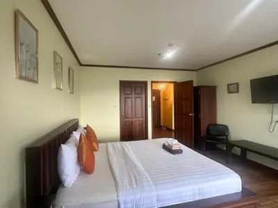 a bedroom with a large bed with white sheets at PATONG TOWER SEA FACING HIGH FLOOR New Bathroom in Patong Beach