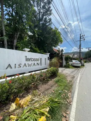 a sign for the forest asian inn on the side of a road at Aisawan Resort villa in Surin Beach