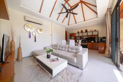 a living room with a couch and a table at Private 2BR Pool Villa 2D03 in Gated Residence Rawai VIP Villas in Rawai Beach