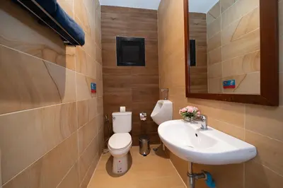a bathroom with a white toilet and a sink at Private 2BR Pool Villa 2D03 in Gated Residence Rawai VIP Villas in Rawai Beach