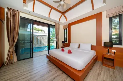 a bedroom with a large white bed and large windows at Private 2BR Pool Villa 2D15 in Gated Residences Rawai VIP Villas near Kids Park in Rawai Beach