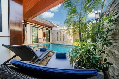 a house with a swimming pool and a hammock and a house at Private 2BR Pool Villa 2D15 in Gated Residences Rawai VIP Villas near Kids Park in Rawai Beach
