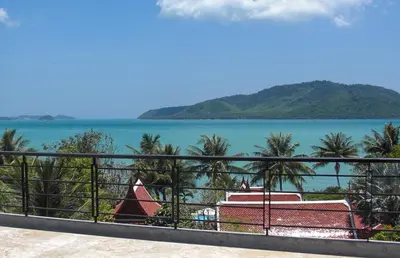 a view of the ocean from a balcony at 13 - Seaside Bliss Overlooking Rawai Beach in Phuket Town