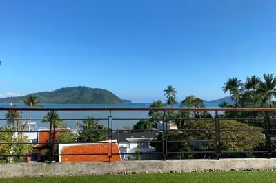a view of the ocean from a balcony at 13 - Seaside Bliss Overlooking Rawai Beach in Phuket Town