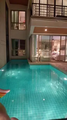 a swimming pool in the middle of a building at 13 - Seaside Bliss Overlooking Rawai Beach in Phuket Town