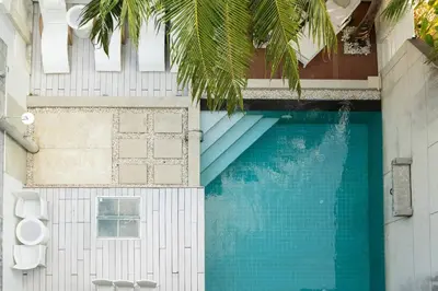 an overhead view of a swimming pool in a building at 13 - Seaside Bliss Overlooking Rawai Beach in Phuket Town