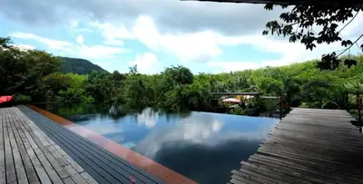 a swimming pool in the middle of a river at 05 - Exquisite Paradise Retreat in Nai Thon Beach