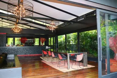 a dining room with a table and chairs at 05 - Exquisite Paradise Retreat in Nai Thon Beach