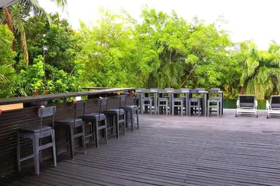 a row of chairs sitting on top of a deck at 05 - Exquisite Paradise Retreat in Nai Thon Beach