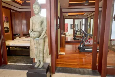 a statue of a woman standing in a room with a gym at Villa 29 Montebello Andara Resort Villas in Kamala Beach