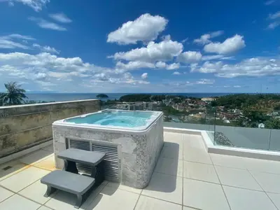 a hot tub on the roof of a house at The View Luxury Condominium Karon in Kata Beach