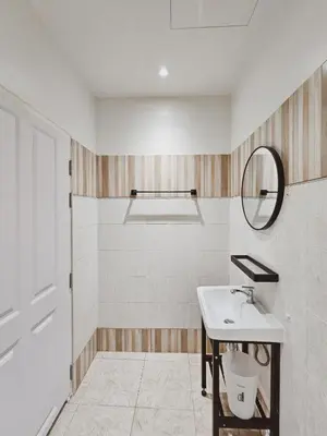 a bathroom with a sink and a mirror at Casa Maya House in Phi Phi Don
