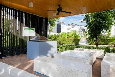 a patio with marble benches and a ceiling fan at Laguna Park 4 Bedrooms Villa by NLA in Phuket Town