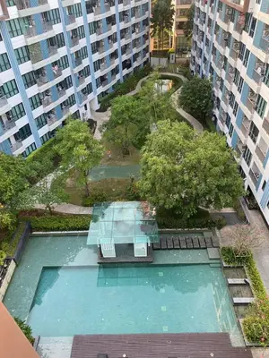 an overhead view of a swimming pool in a building at Centrio Condominiums Top Floor with Pool and Garden view in Ban Na Khua