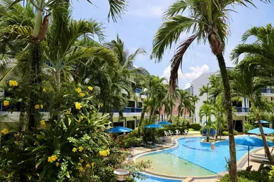a pool at the resort with palm trees at 4-5 bedroom Villa At Kamala Beach, Pool in Kamala Beach