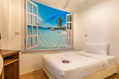 a bedroom with a bed with a large window at 4-5 bedroom Villa At Kamala Beach, Pool in Kamala Beach