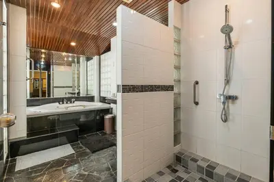 a bathroom with a shower and a sink and a tub at 4-5 bedroom Villa At Kamala Beach, Pool in Kamala Beach