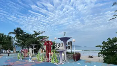 a view of a beach with a cloudy sky at Patong Vacation Condos by Pam - 28 SQM modern condos with private bathroom, kitchen, King Bed, free WiFi and 65 inch smart TC in Patong Beach