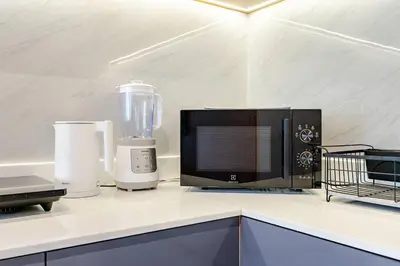 a kitchen counter with a microwave and a blender at WEG NaiThon Beach in Nai Thon Beach
