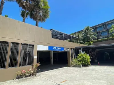 a building with a sign that reads car park garage at The Pixel Cape Panwa Beach Condo in Panwa Beach