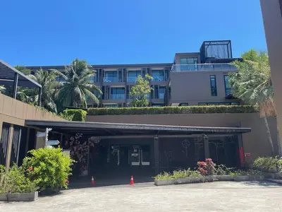 a building with plants on the side of it at The Pixel Cape Panwa Beach Condo in Panwa Beach