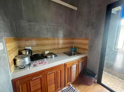 a kitchen with two pots and a sink at Studio Apartment 12 in Thalang in Ban Phak Chit