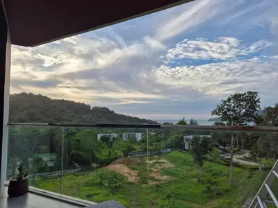 a room with a large window with a view at The viva patong condo C602 in Patong Beach