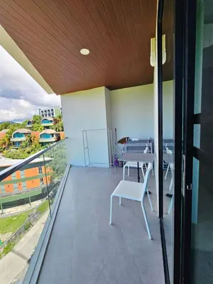 a balcony with a table and chairs on it at The viva patong condo C602 in Patong Beach